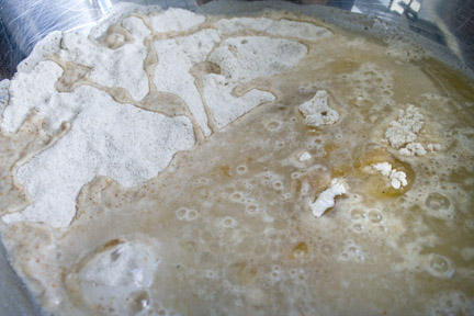 Mix in olive oil and water Mix in olive oil and water